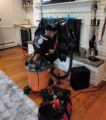 Chimney cleaning equipment prepared at a residential fireplace